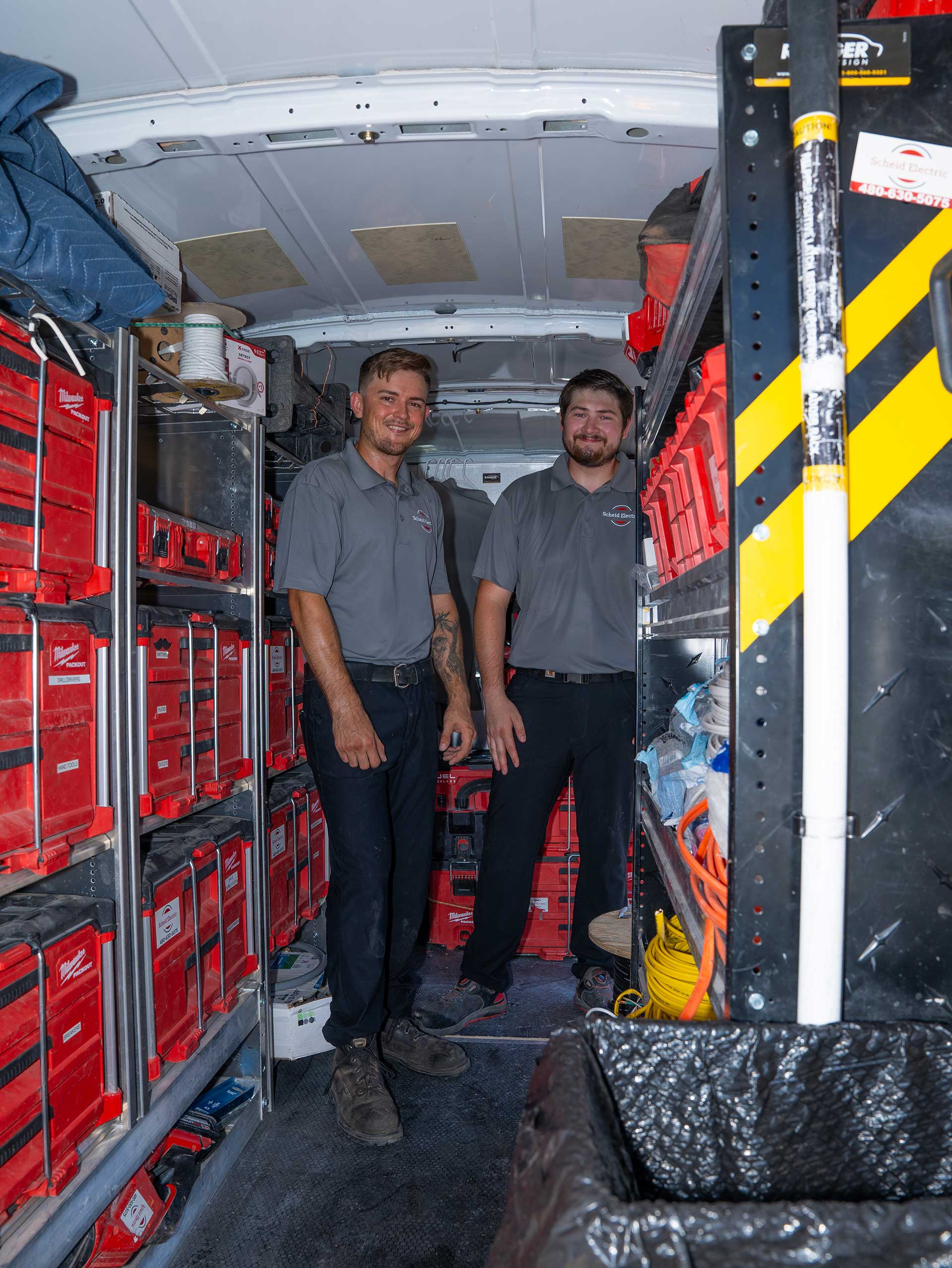 Schied Electric Electricians Smiling In Van